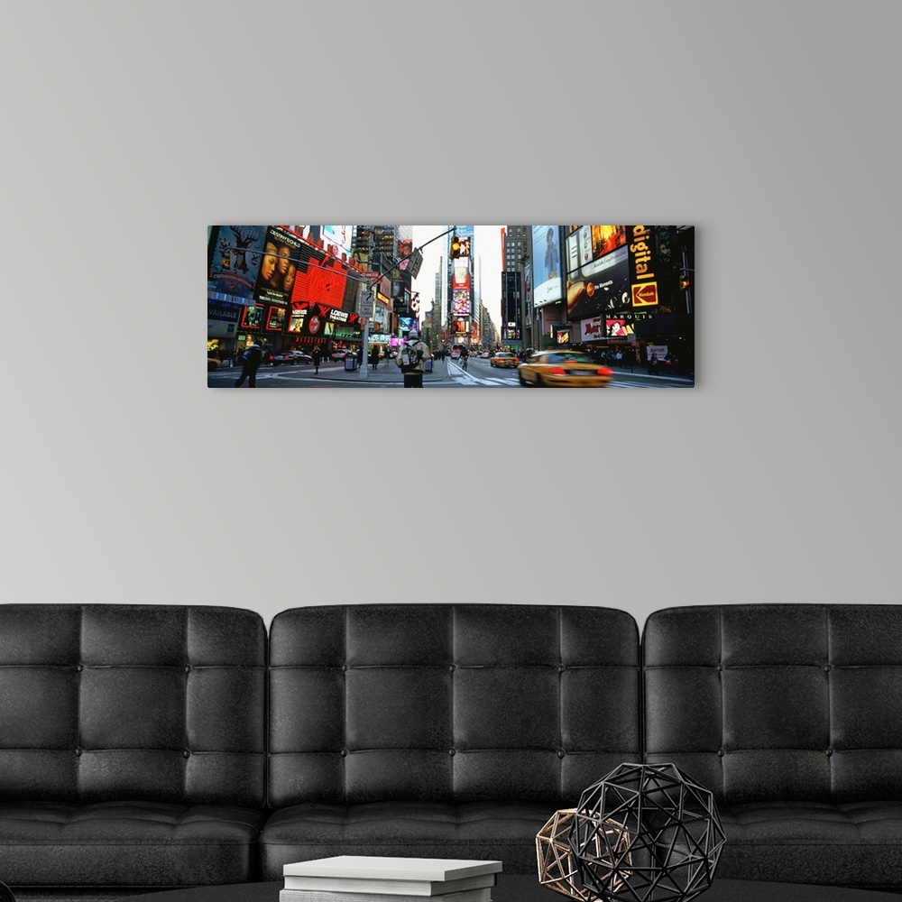 A modern room featuring Times Square, NYC with neon signs.