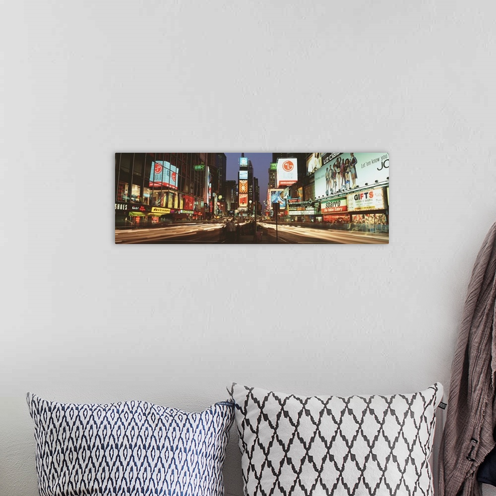 A bohemian room featuring Giant landscape photograph of the lights of Times Square in downtown New York City at night, the ...