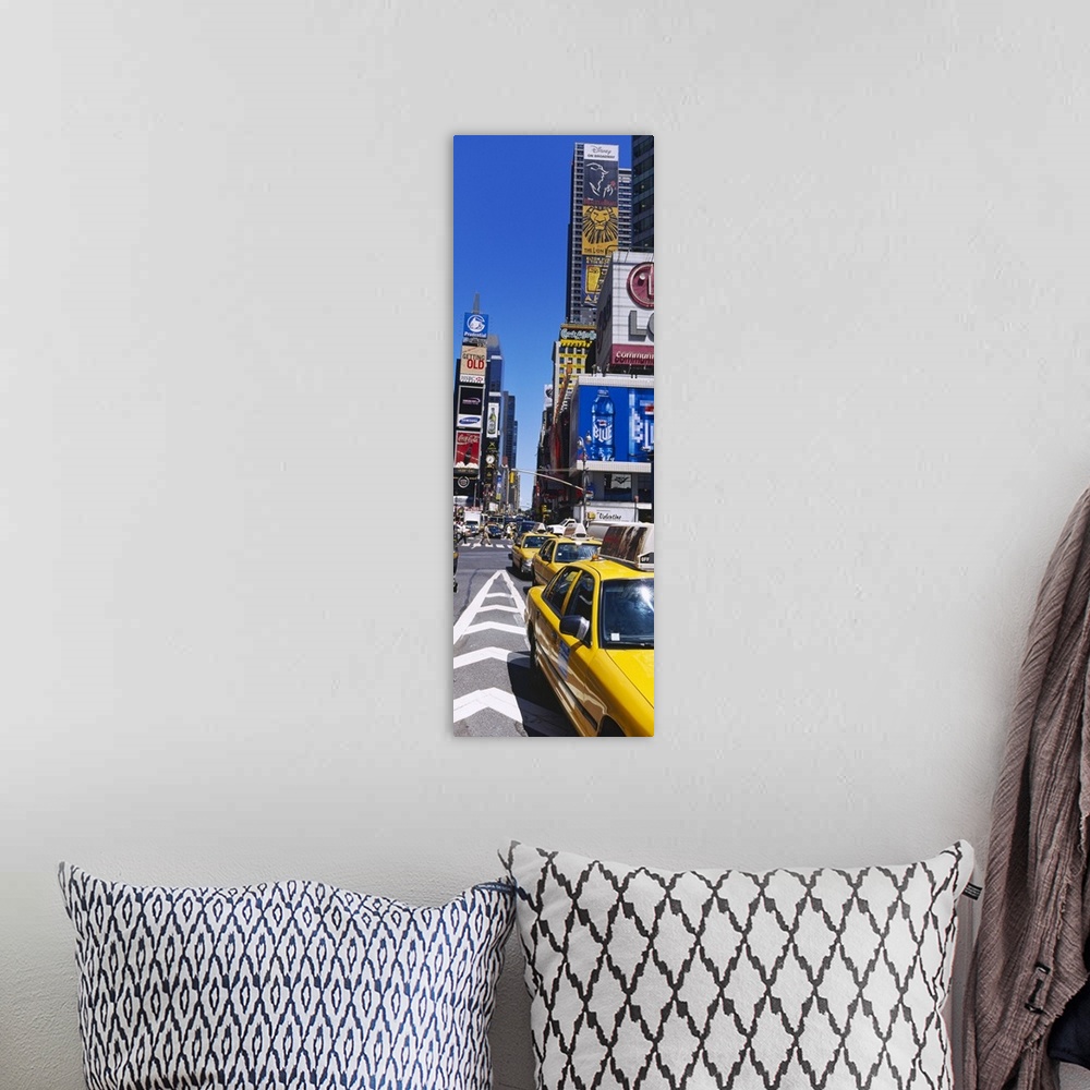 A bohemian room featuring Vertical panoramic photograph taken of a busy street in Times Square.