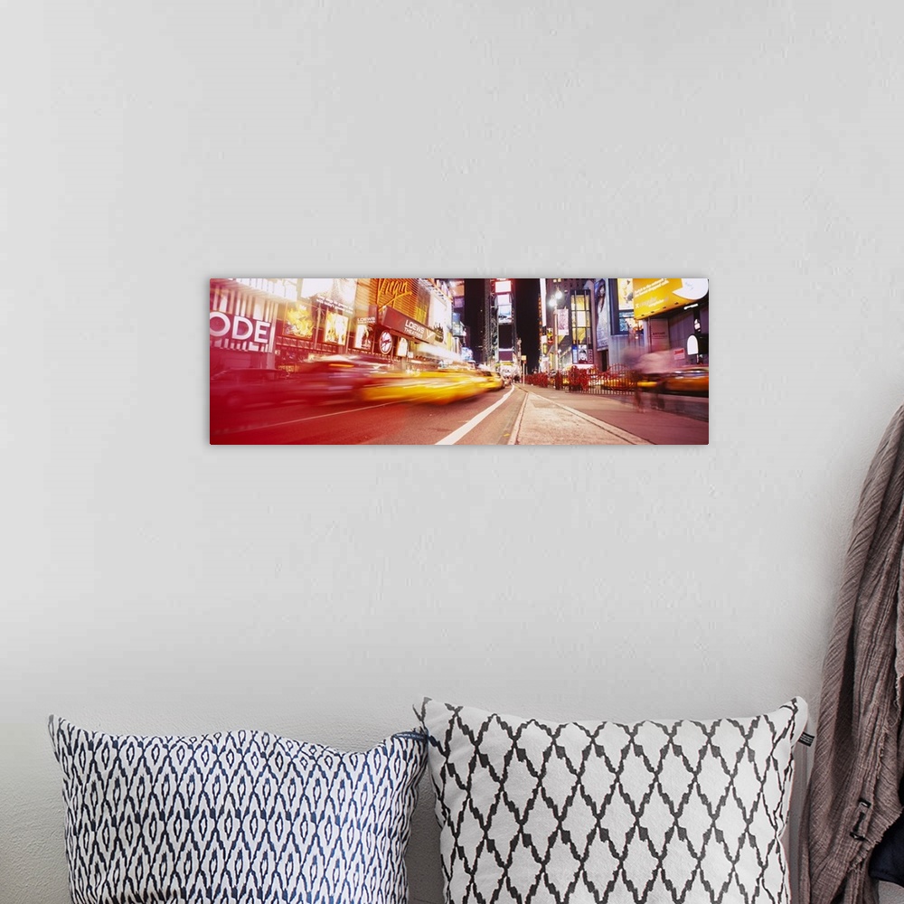 A bohemian room featuring Big, horizontal photograph of blurred traffic driving down the road leading through Times Square,...