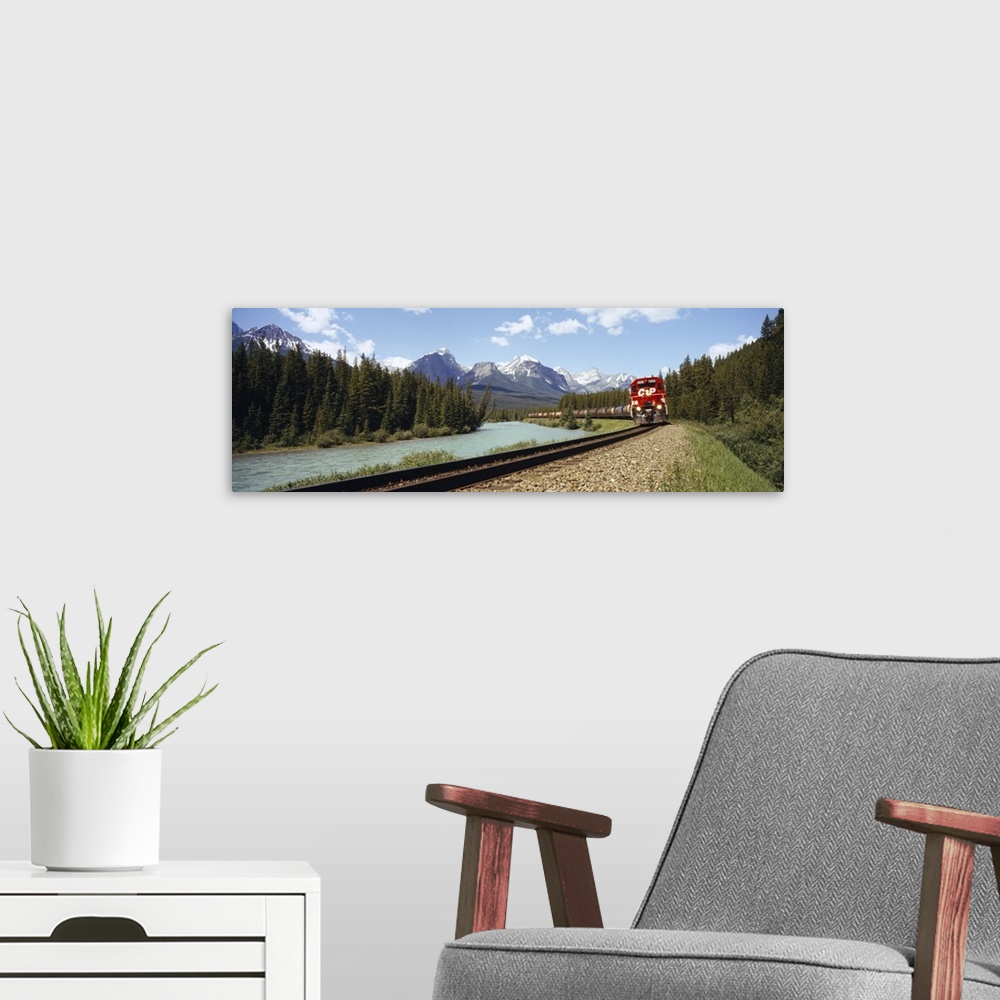A modern room featuring Train on a railroad track, Morants Curve, Banff National Park, Alberta, Canada