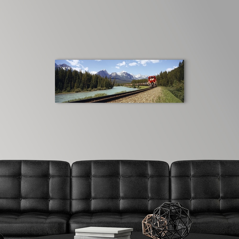 A modern room featuring Train on a railroad track, Morants Curve, Banff National Park, Alberta, Canada