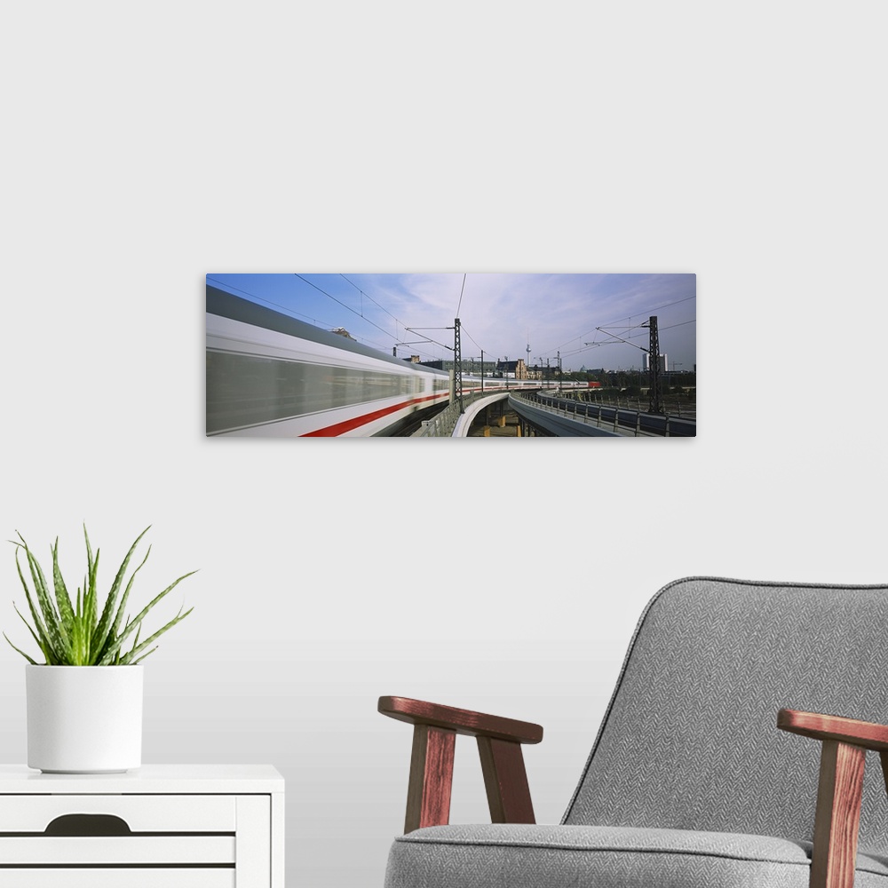 A modern room featuring Trains arriving and leaving the train station, Hauptbahnhof, Central Station, Berlin, Germany