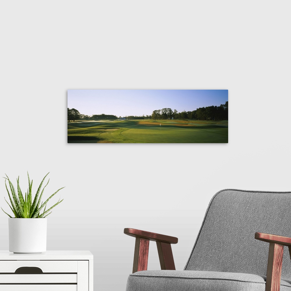 A modern room featuring Trees on a golf course, The Carolina Club, Outer Banks, North Carolina