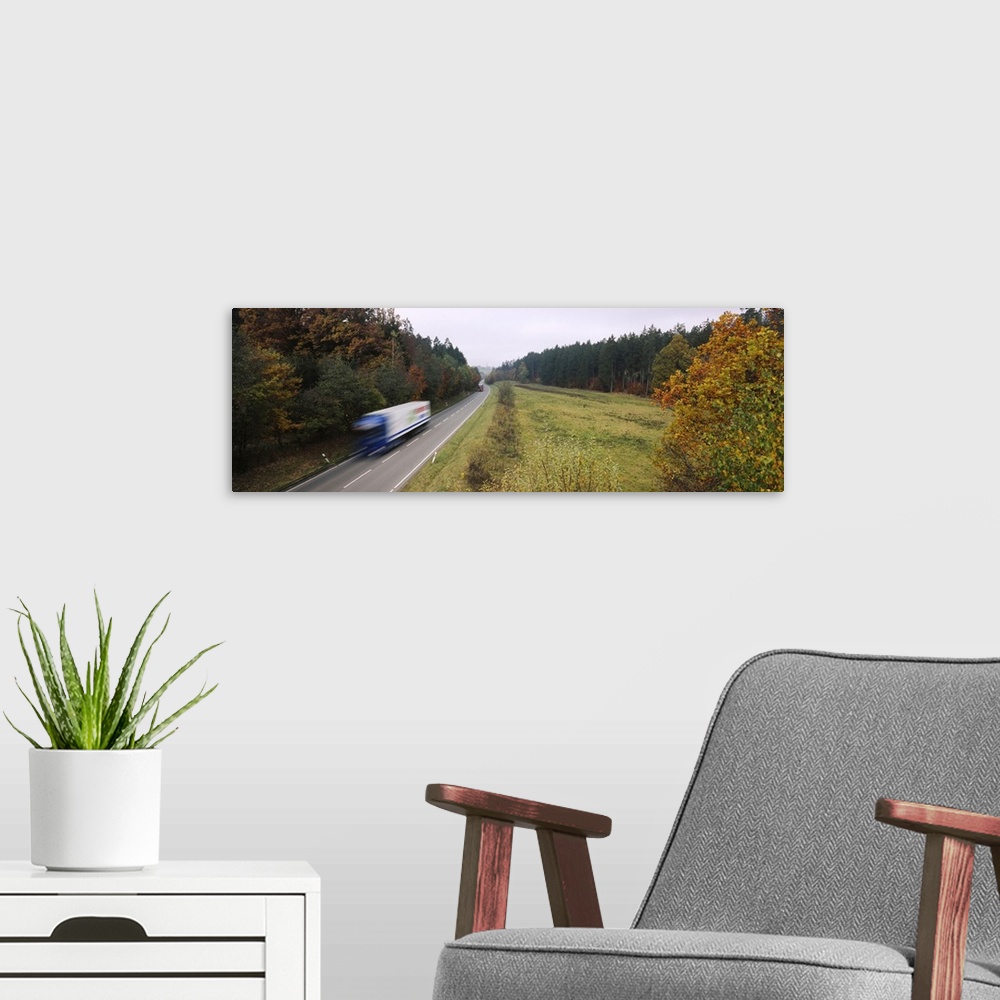 A modern room featuring Truck on a road, Fall, Baden-Wurttemberg, Germany