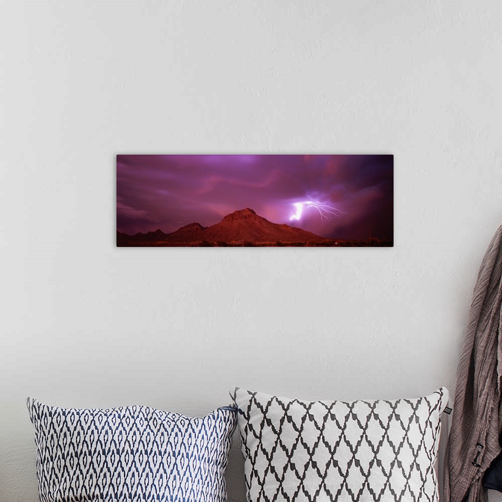 A bohemian room featuring Stunning panoramic photograph of a lightning strike over the mountains in Tucson, Arizona.