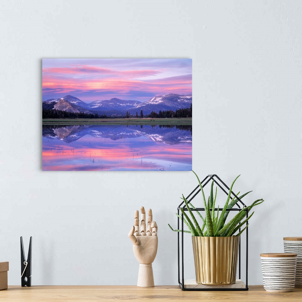 A bohemian room featuring Photograph of waterfront with reflected snow capped mountains and forest in the distance.