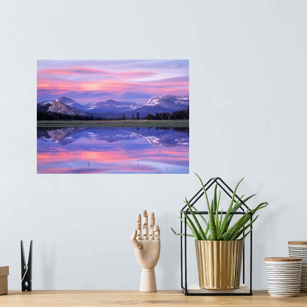 A bohemian room featuring Photograph of waterfront with reflected snow capped mountains and forest in the distance.