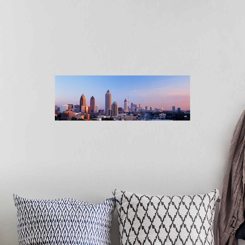 A bohemian room featuring Panoramic photograph of Atlanta skyline at sunset.