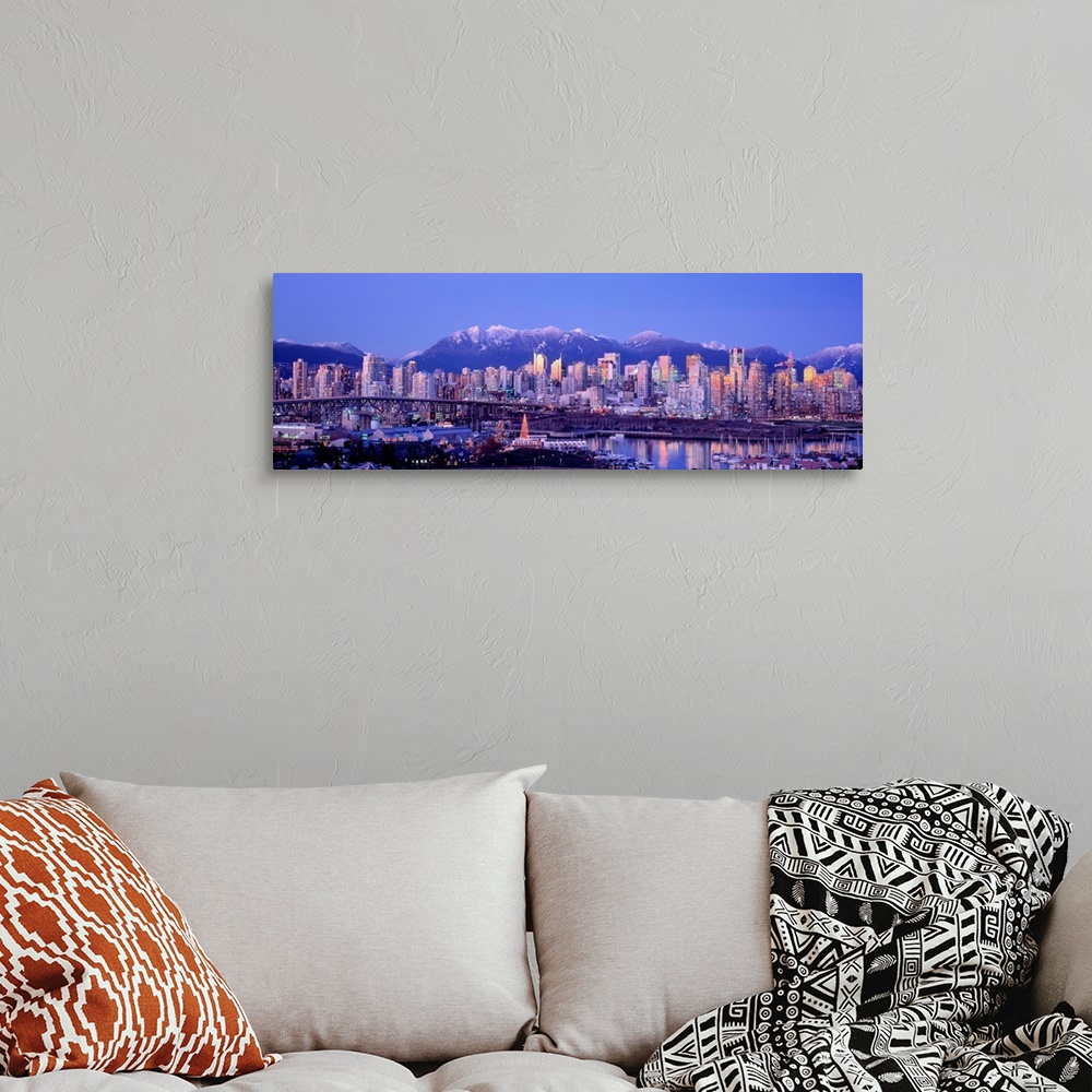 A bohemian room featuring The city skyline is packed with skyscrapers and a harbor full of boats is built into the shore in...