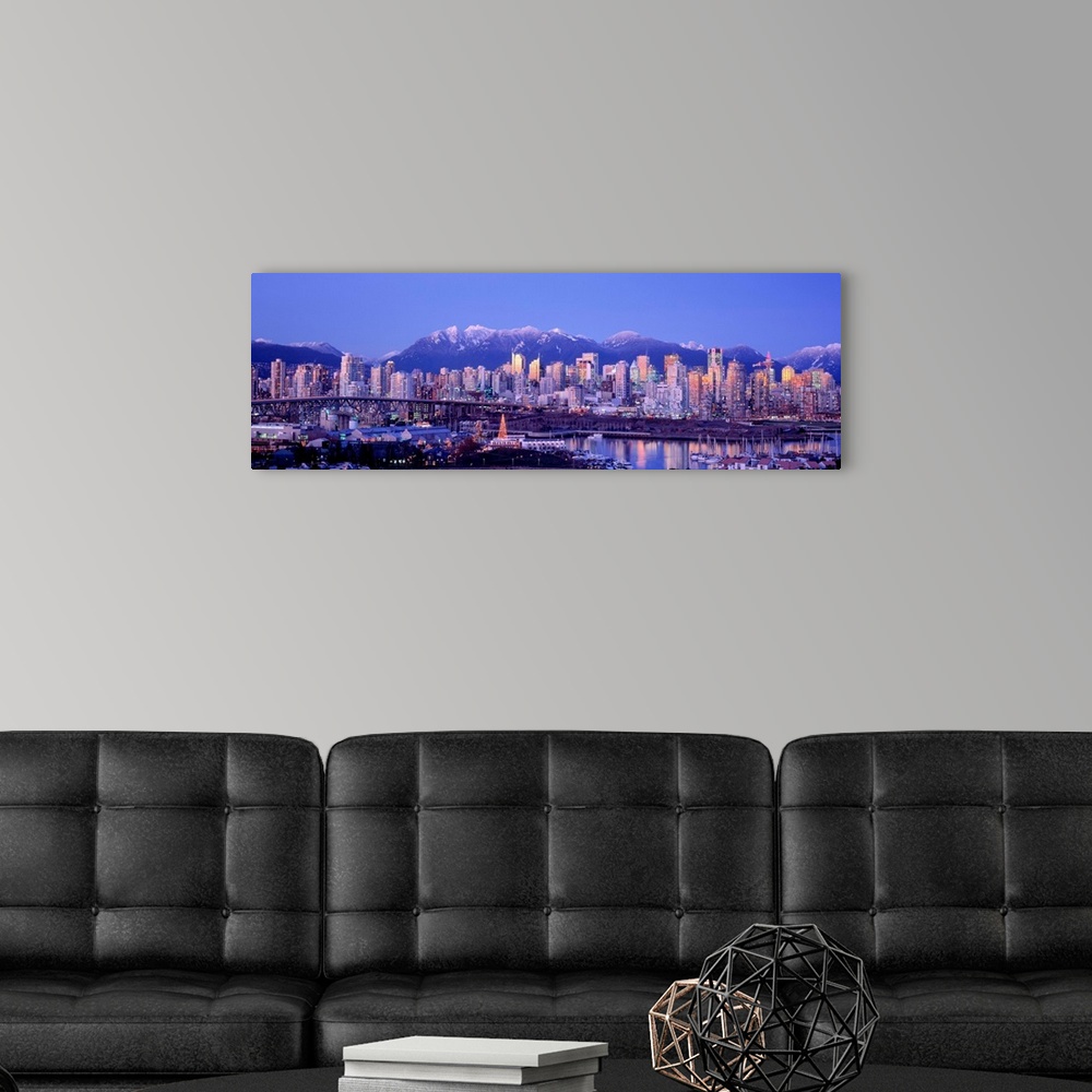 A modern room featuring The city skyline is packed with skyscrapers and a harbor full of boats is built into the shore in...