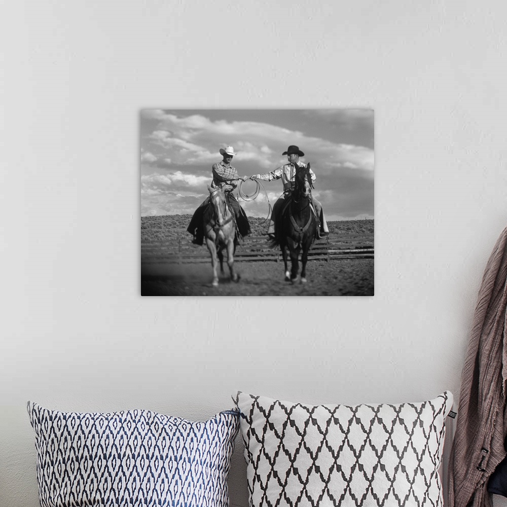 A bohemian room featuring Two Cowboys on Horseback