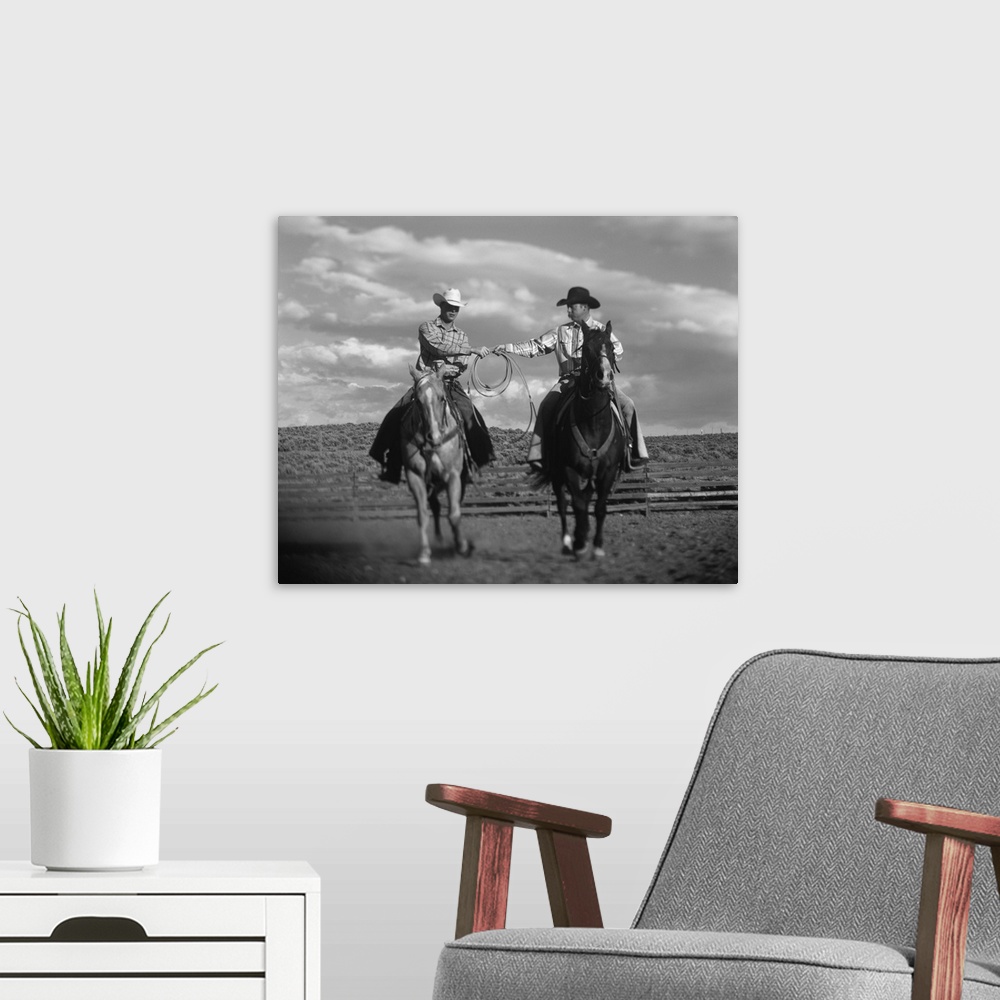 A modern room featuring Two Cowboys on Horseback