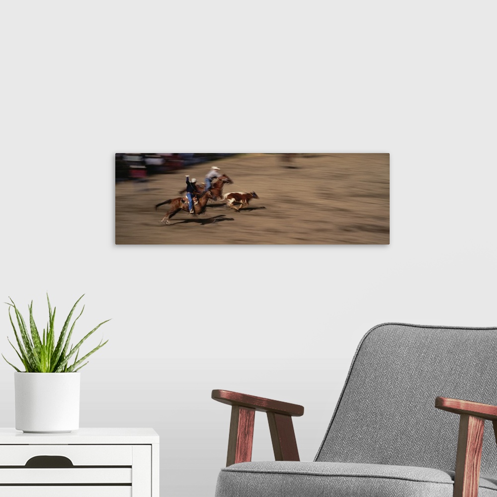 A modern room featuring Two cowboys roping a cow, Washington State