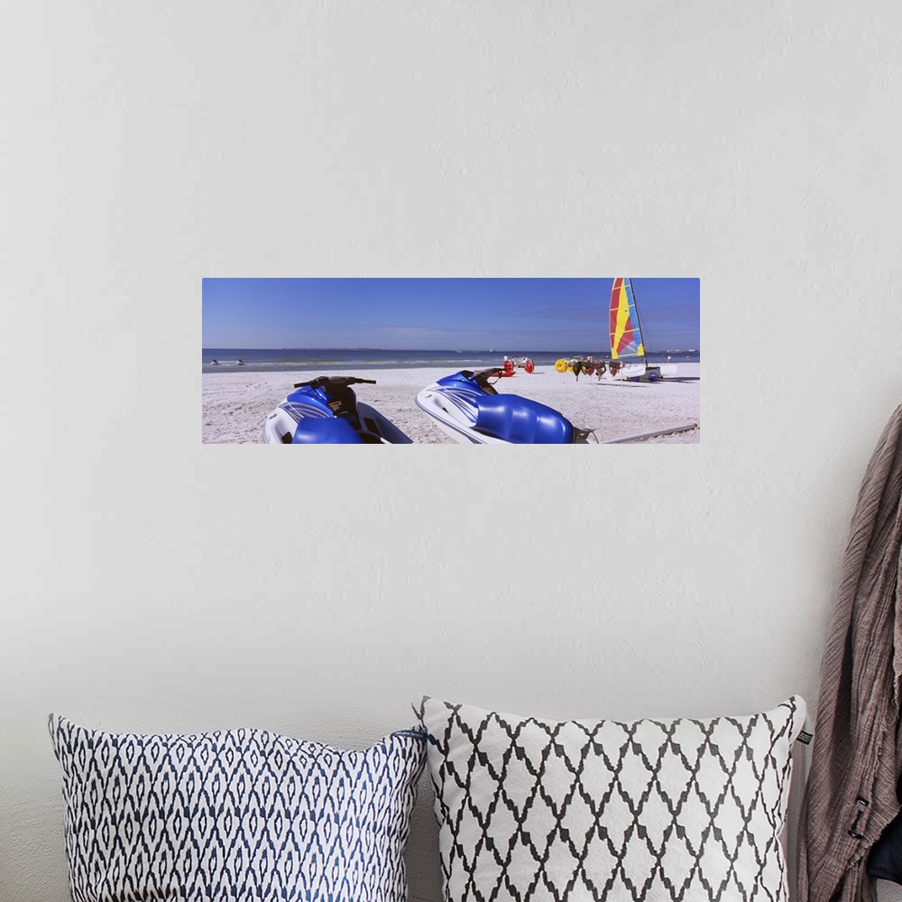 A bohemian room featuring Two jet boats and a windsurfing board on the beach, Fort Myers Beach, Bowditch Point Regional Par...