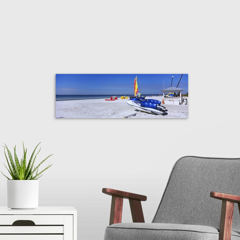 A modern room featuring Two jet boats and a windsurfing board on the beach, Fort Myers Beach, Bowditch Point Regional Par...
