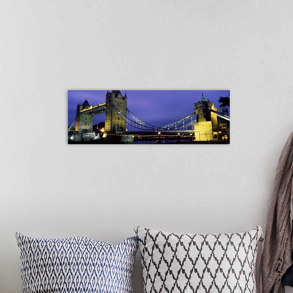 A bohemian room featuring Panorama of London's iconic Tower Bridge at night.