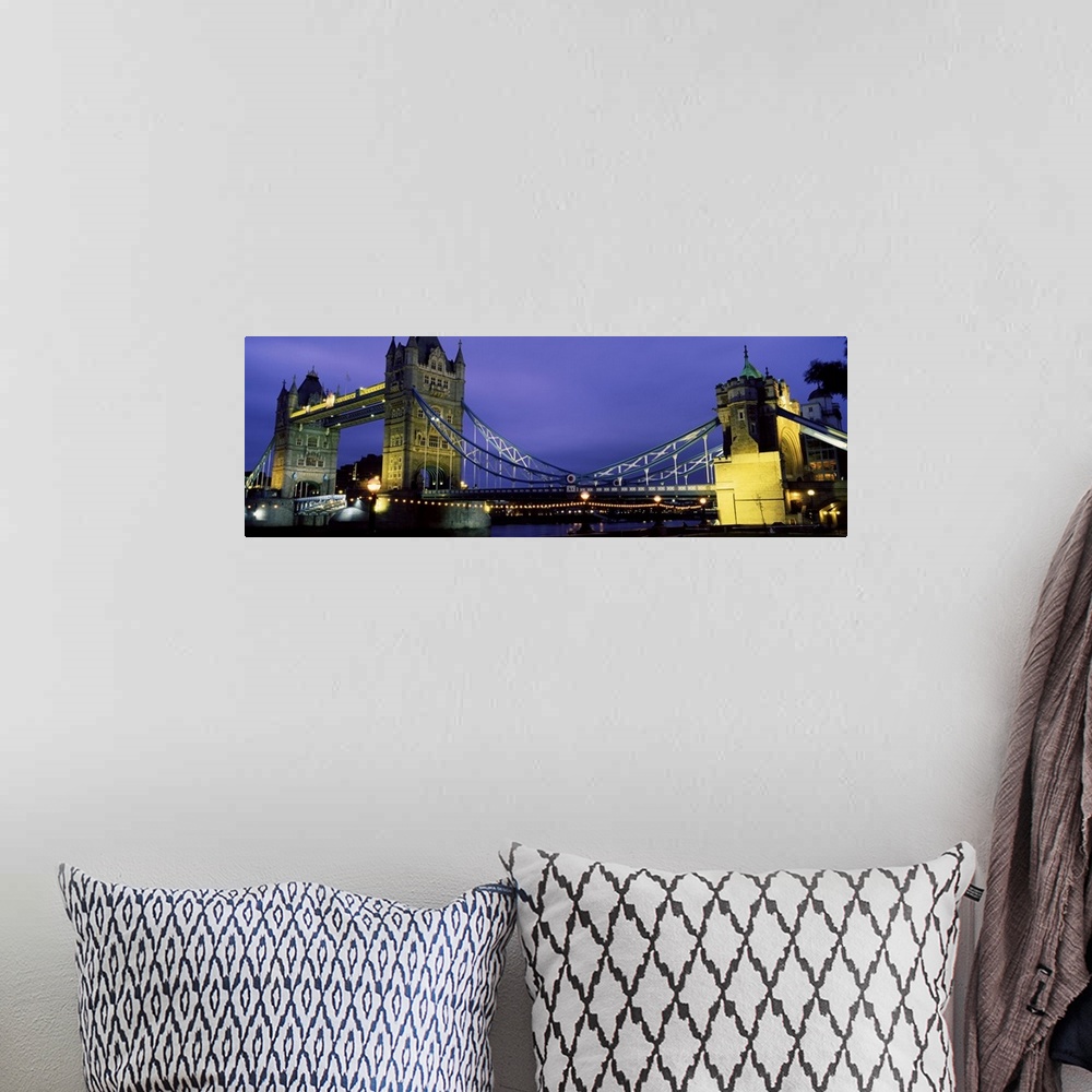 A bohemian room featuring Panorama of London's iconic Tower Bridge at night.