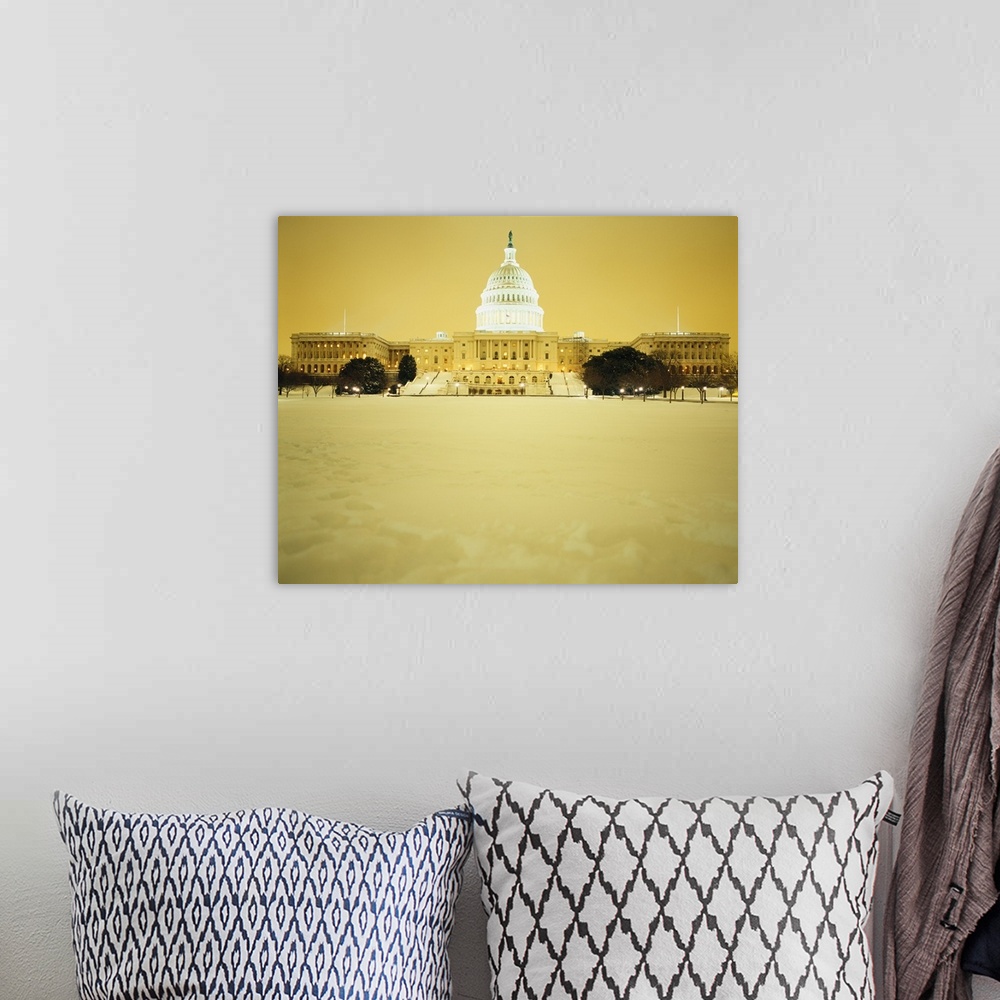 A bohemian room featuring US Capitol Building illuminated at night with snow, Washington DC
