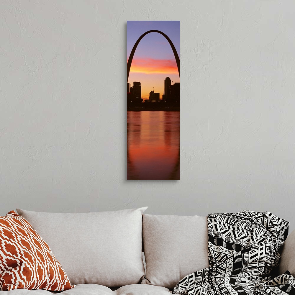 A bohemian room featuring Vertical photograph on a big canvas of the Gateway Arch over St. Louis, Missouri, at sunrise.