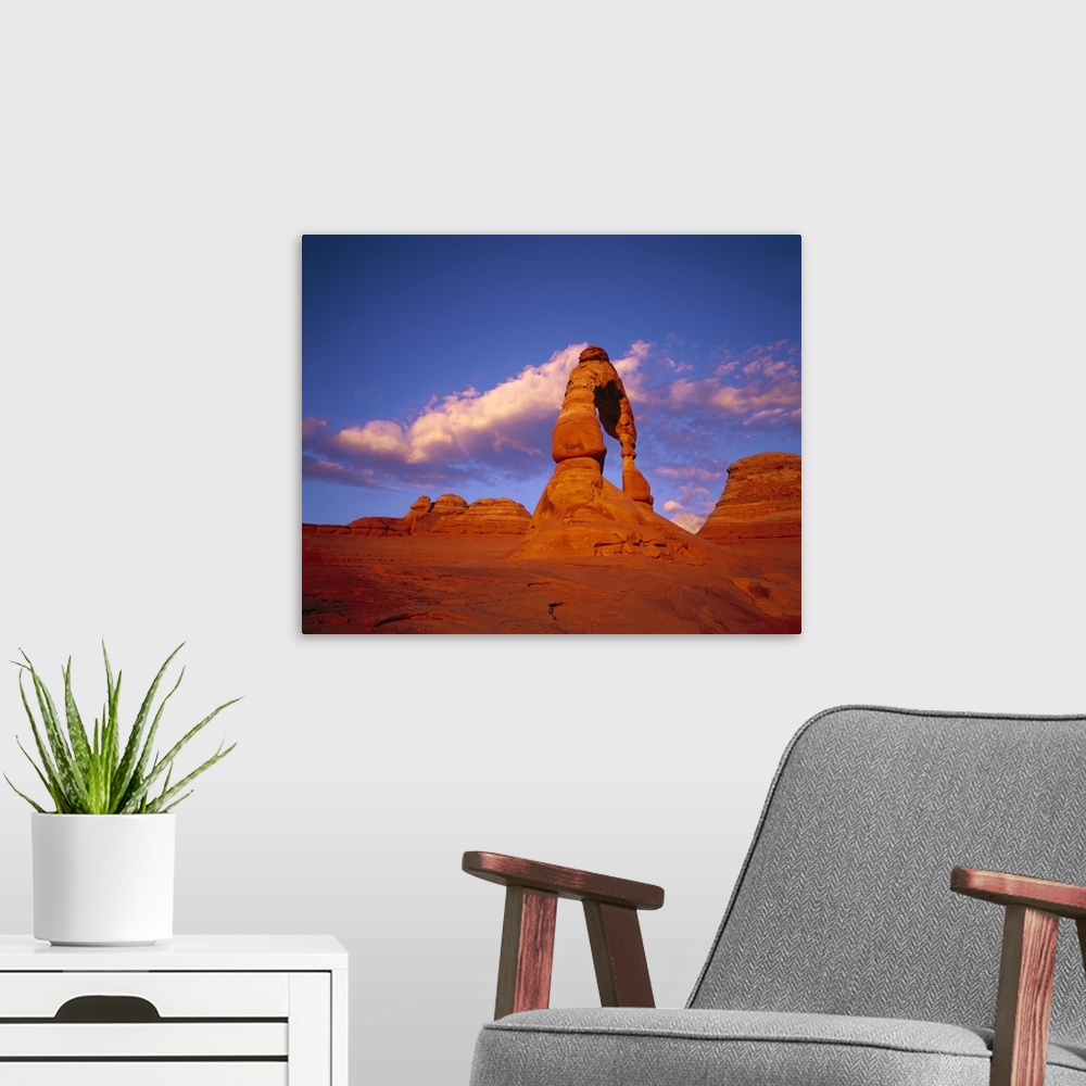 A modern room featuring Image of the red rock arch formations in the Utah desert beneath a clear sky.