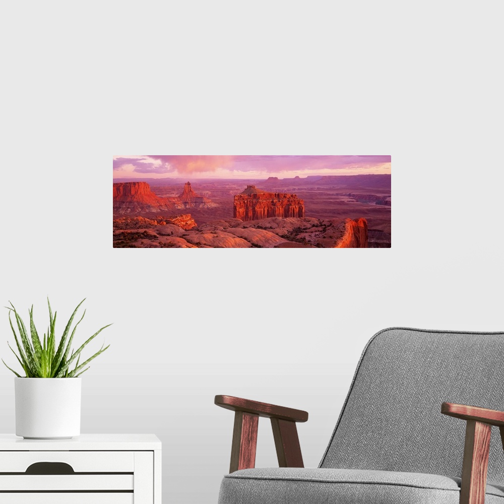 A modern room featuring Wide angle, aerial photograph of the rocky terrain at Canyonlands National Park in Utah, beneath ...