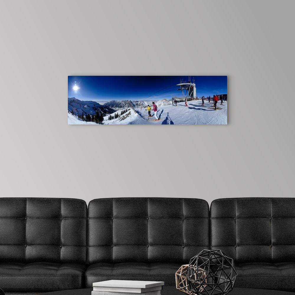 A modern room featuring Panoramic photo on canvas of people skiing on a snowy mountain in Utah.