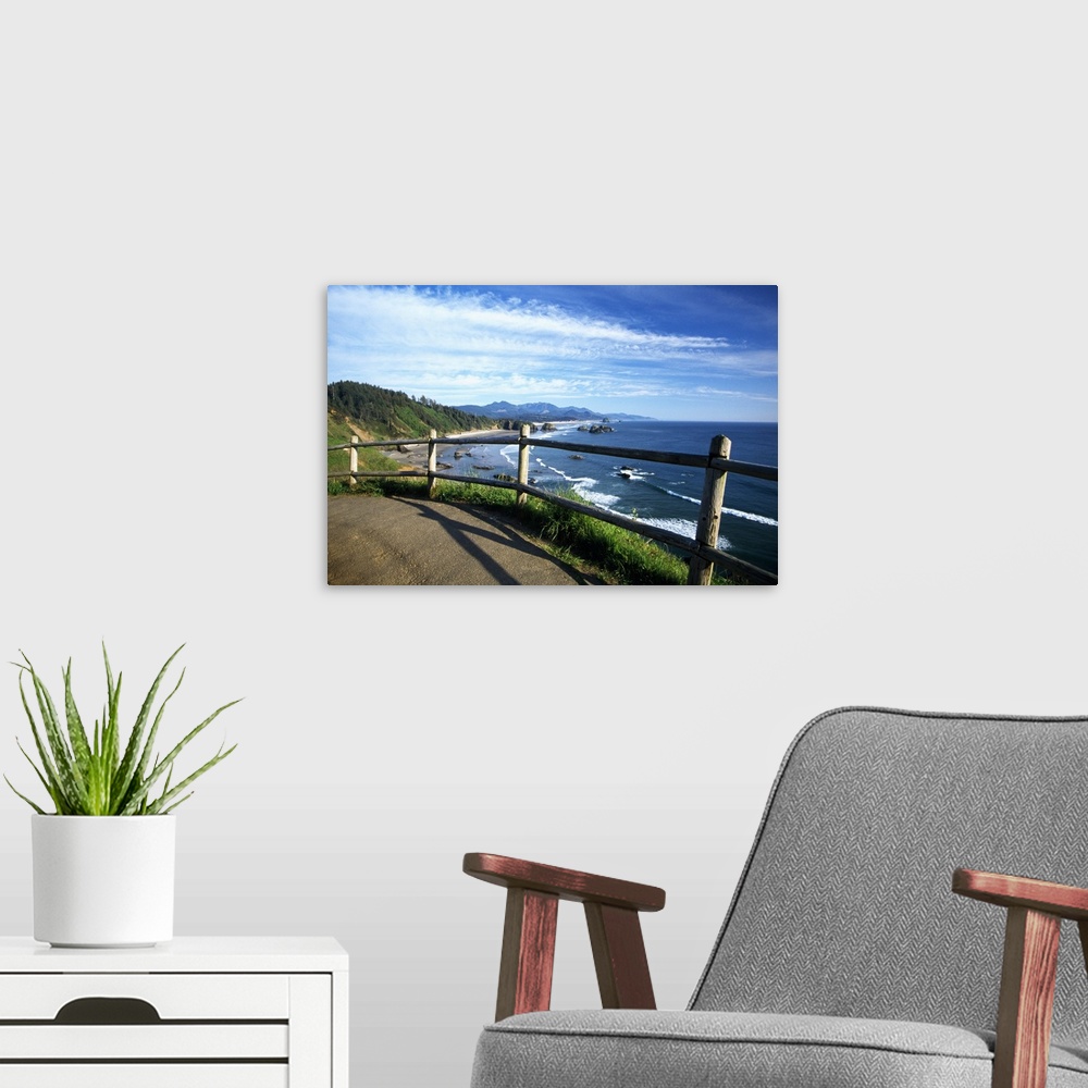 A modern room featuring This photograph is taken from a walking trail while looking out at the coast in Oregon with rock ...