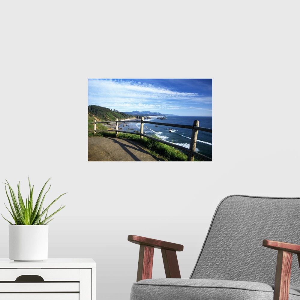A modern room featuring This photograph is taken from a walking trail while looking out at the coast in Oregon with rock ...