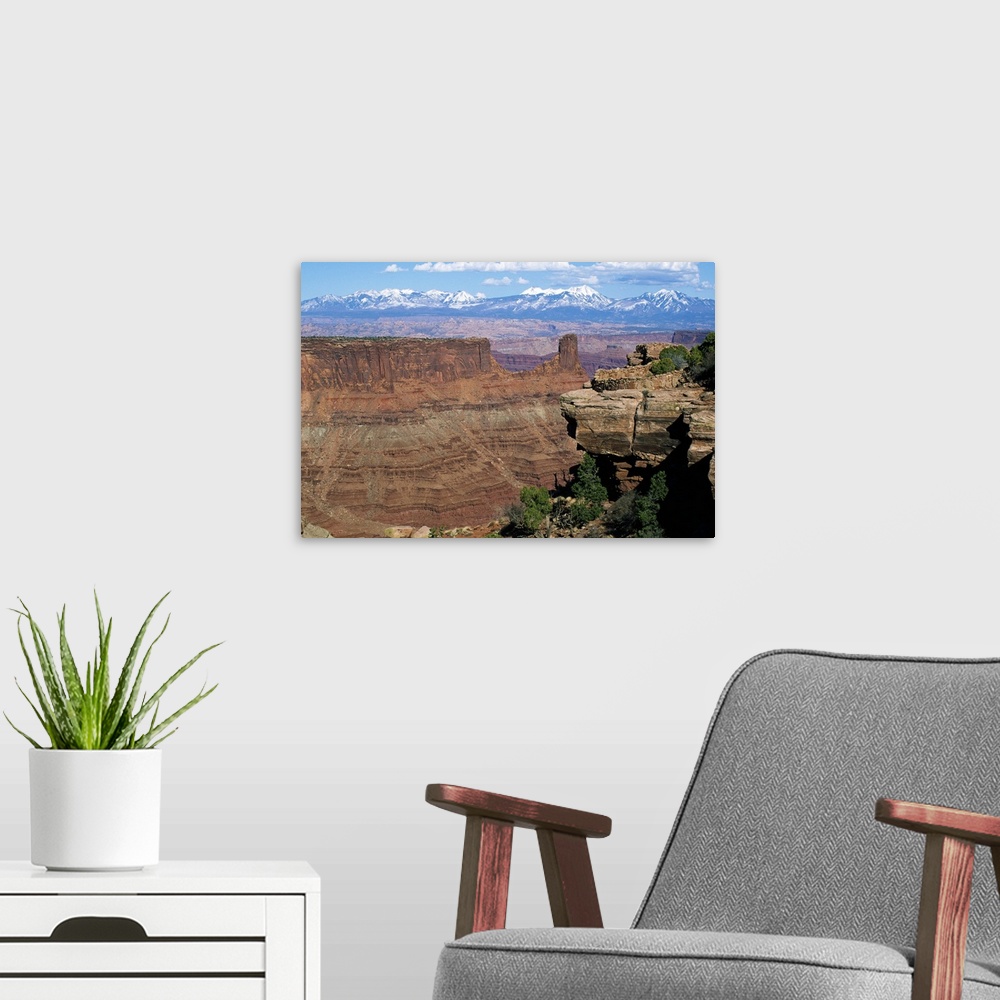 A modern room featuring View of Island in the Sky District, distant snow-capped mountains, Canyonlands National Park, Utah