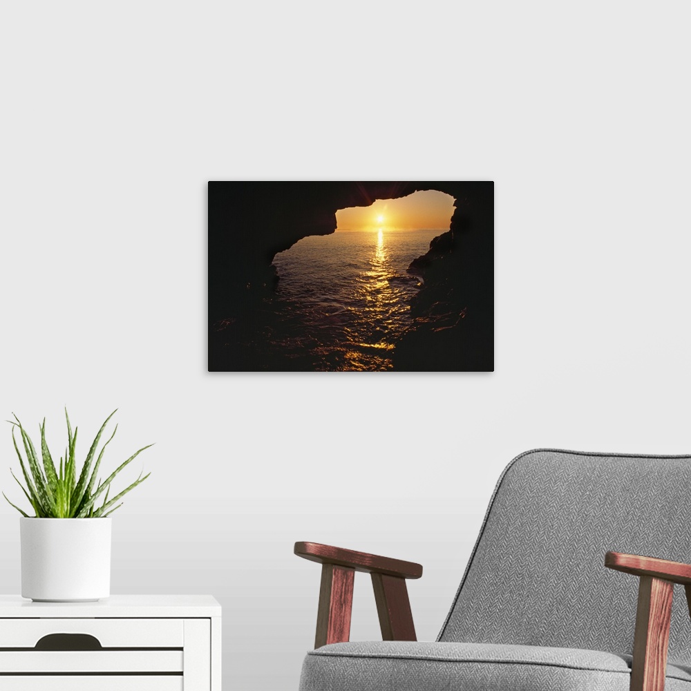 A modern room featuring View Of Ocean Sunrise From Inside Anenome Cave