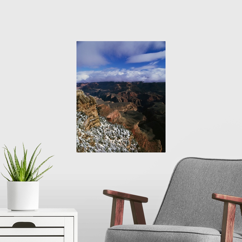A modern room featuring View of snow and storm clouds over Grand Canyon from Mather Point, south rim, Grand Canyon Nation...
