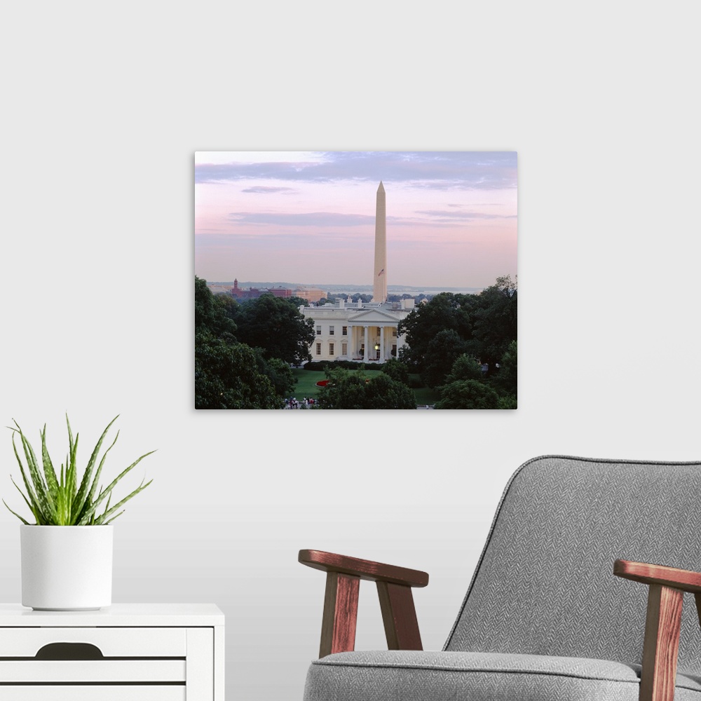 A modern room featuring Giant landscape photograph on a large wall hanging looking over tree tops at the White House and ...