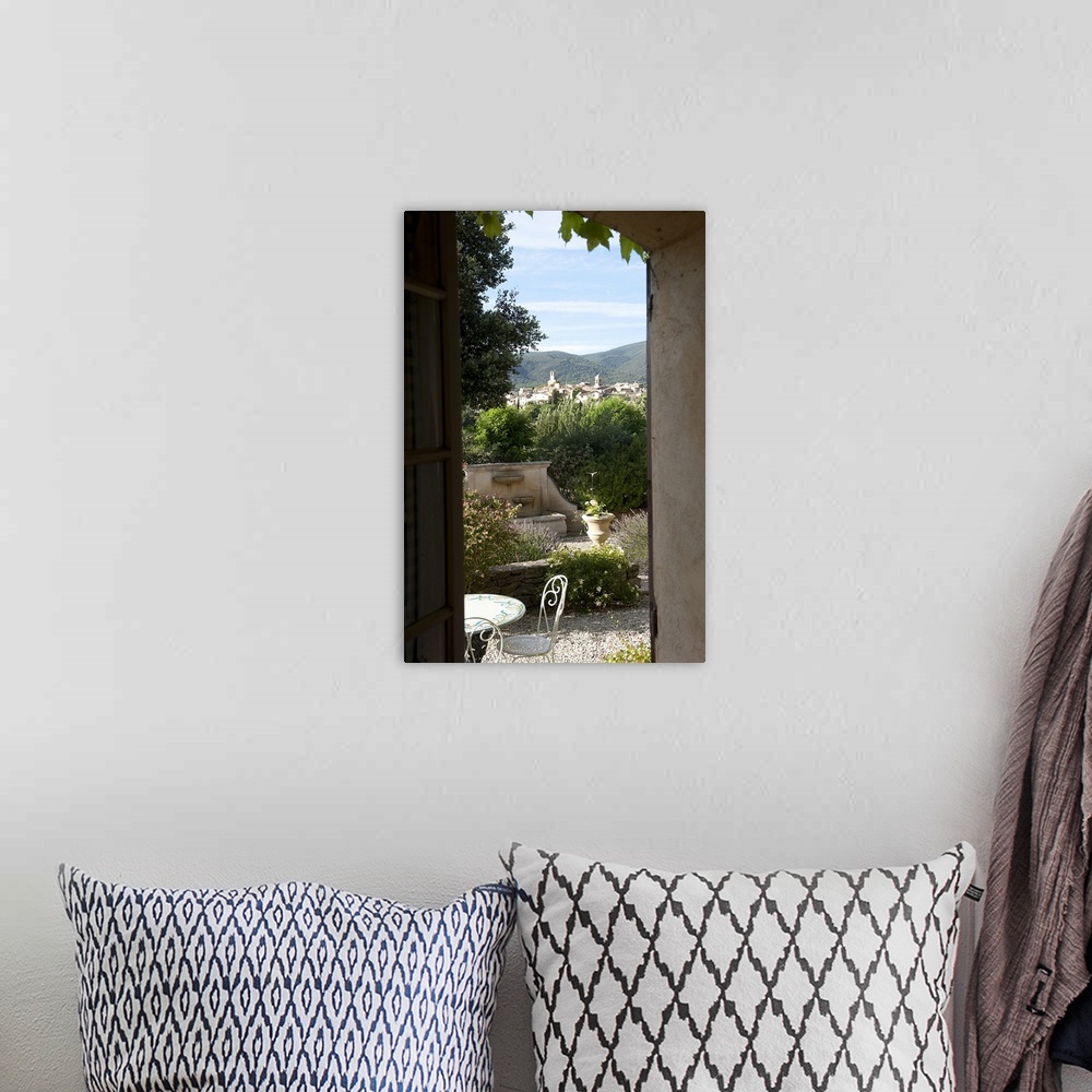 A bohemian room featuring Village viewed through from a window of a house, Lourmarin, Luberon
