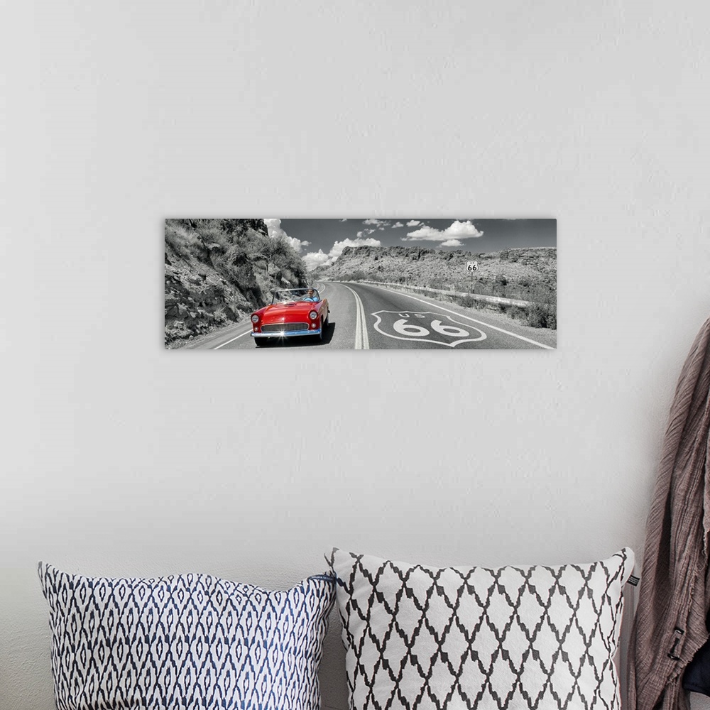 A bohemian room featuring Panoramic photograph displays a classic car cruising down a highway with rocky canyons on both si...
