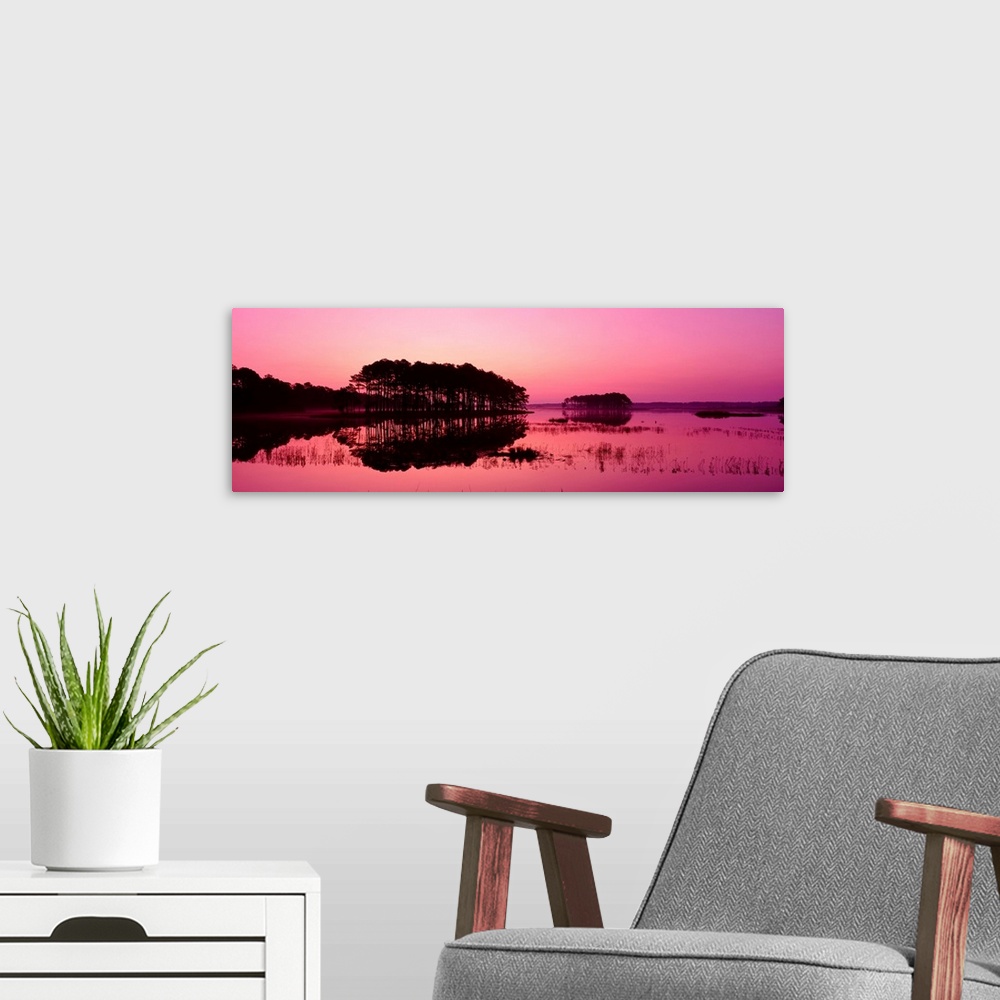 A modern room featuring Virginia, Chincoteague National Wildlife Refuge, Panoramic view of the national forest during sunset