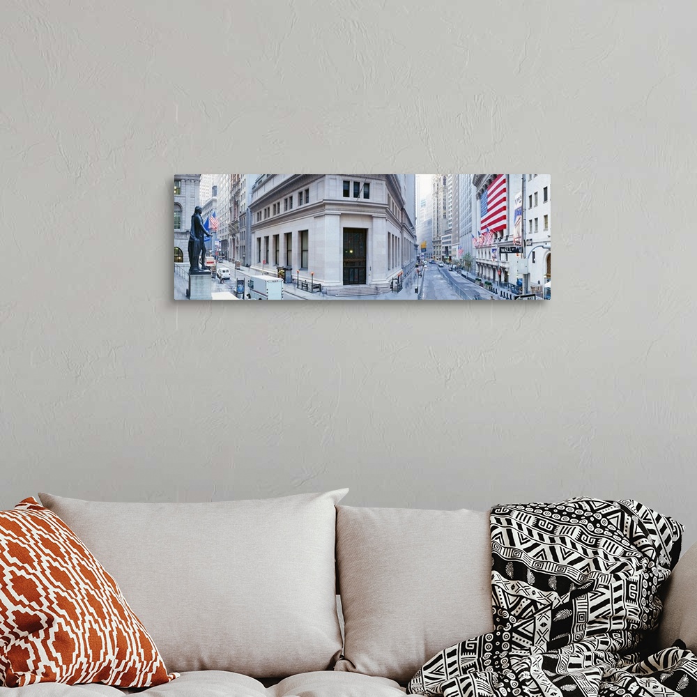 A bohemian room featuring Panoramic photo of a major financial district in NYC with a big American flag hanging outside of ...