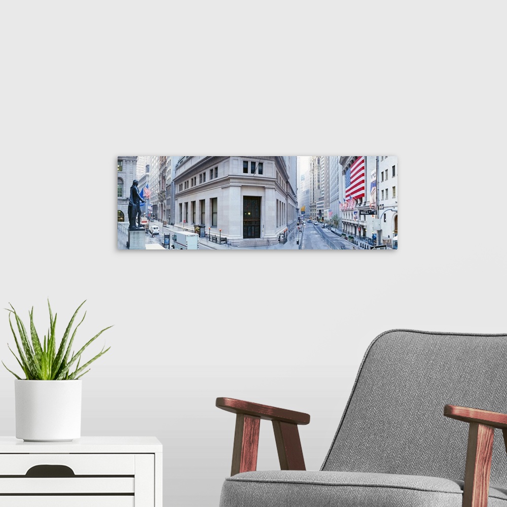 A modern room featuring Panoramic photo of a major financial district in NYC with a big American flag hanging outside of ...