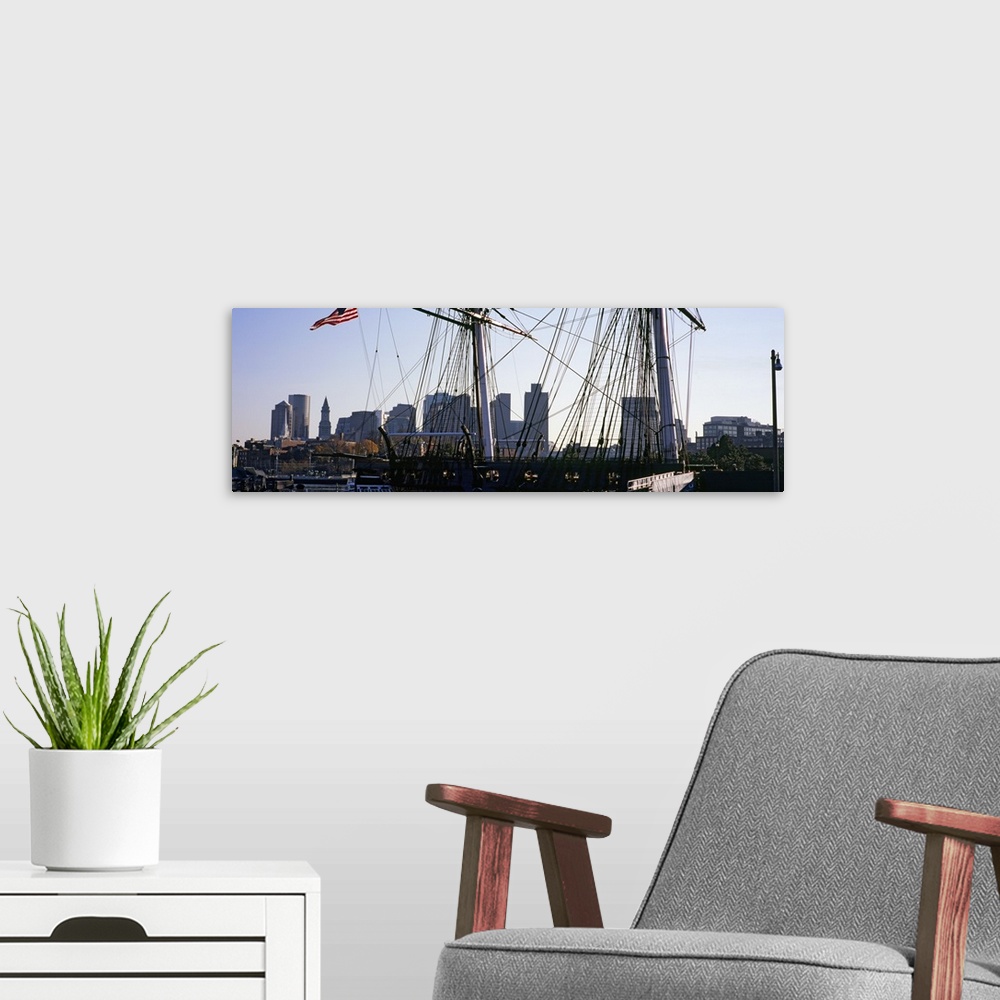 A modern room featuring Warship at a harbor in front of skyscrapers, USS Constitution, Freedom Trail, Boston, Massachusetts