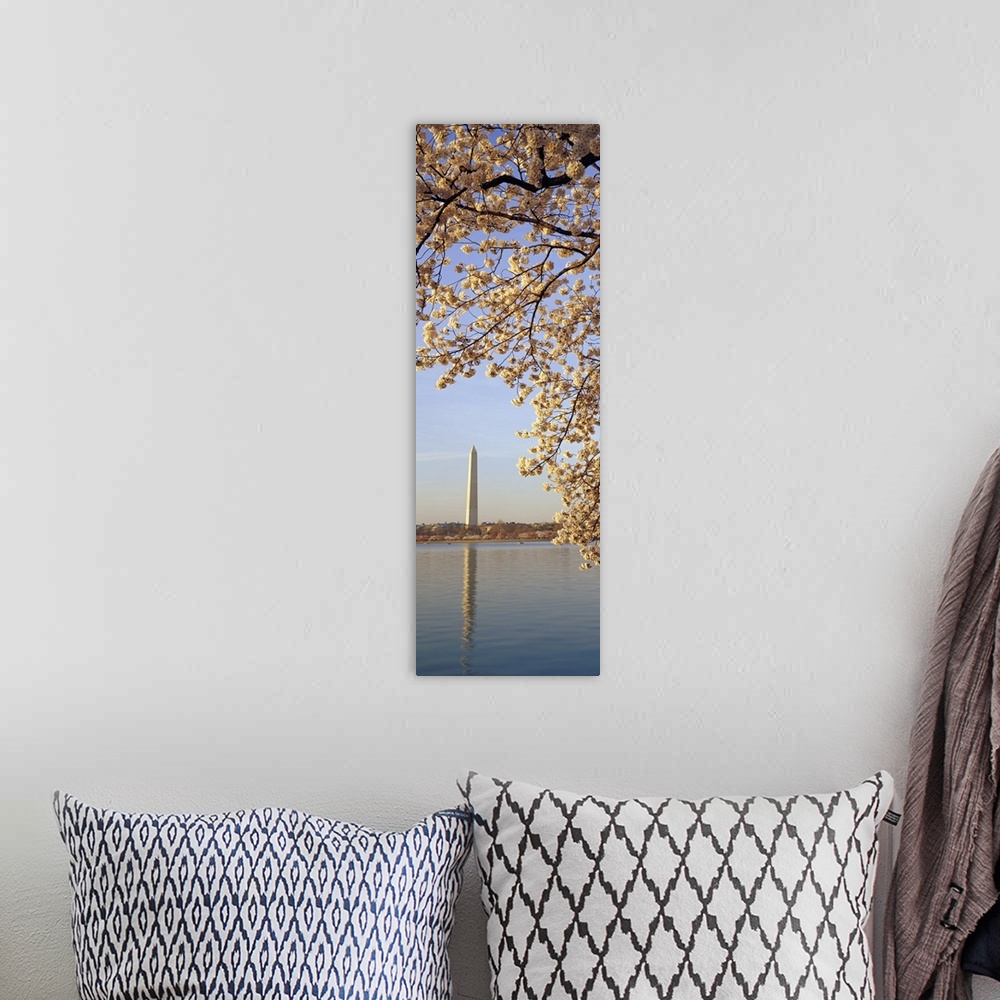 A bohemian room featuring Vertical, oversized photograph of  the branches of a cherry blossom tree in bloom, hanging over t...