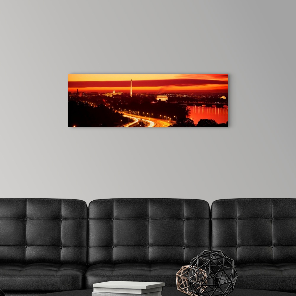 A modern room featuring This time lapsed photograph shows the Capitol building, Washington Monument, the Lincoln Memorial...