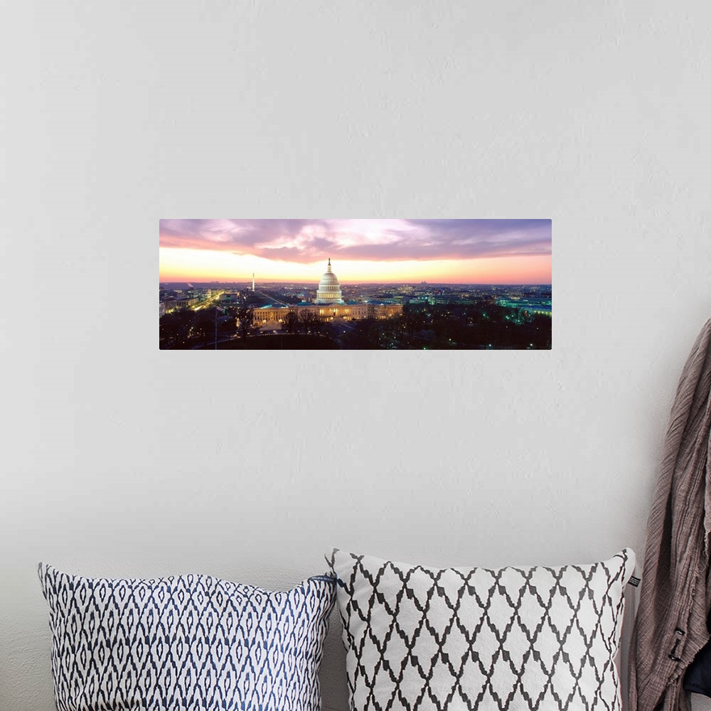 A bohemian room featuring A high angle photograph of the Capital Building and National Mall illuminated in the evening light.