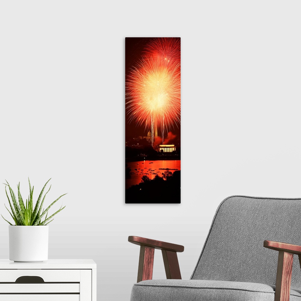 A modern room featuring Washington DC, Fireworks over a city