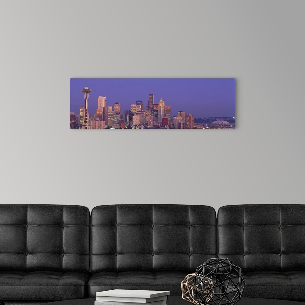 A modern room featuring Panoramic photograph of lit up skyline at dusk with iconic buildings such as the Space Needle, Co...