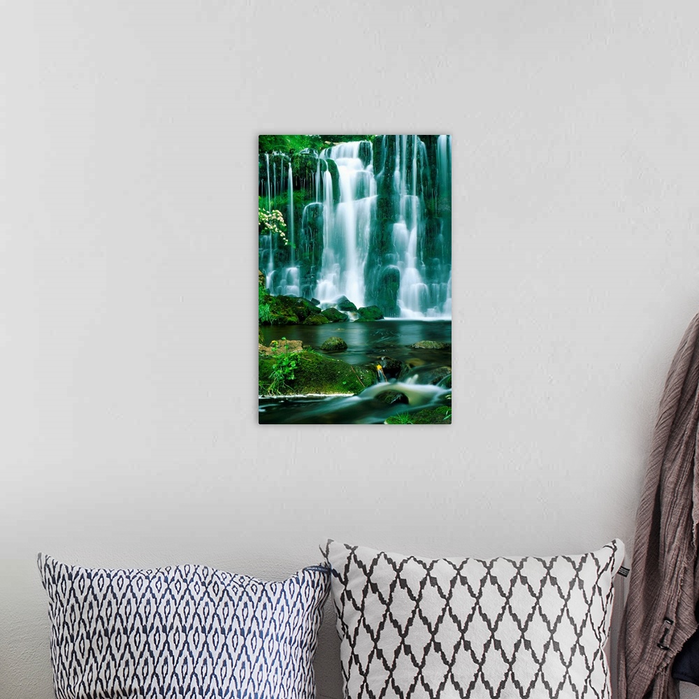 A bohemian room featuring This oversized art work is a time lapse photograph capturing the continuous cascade of water flow...