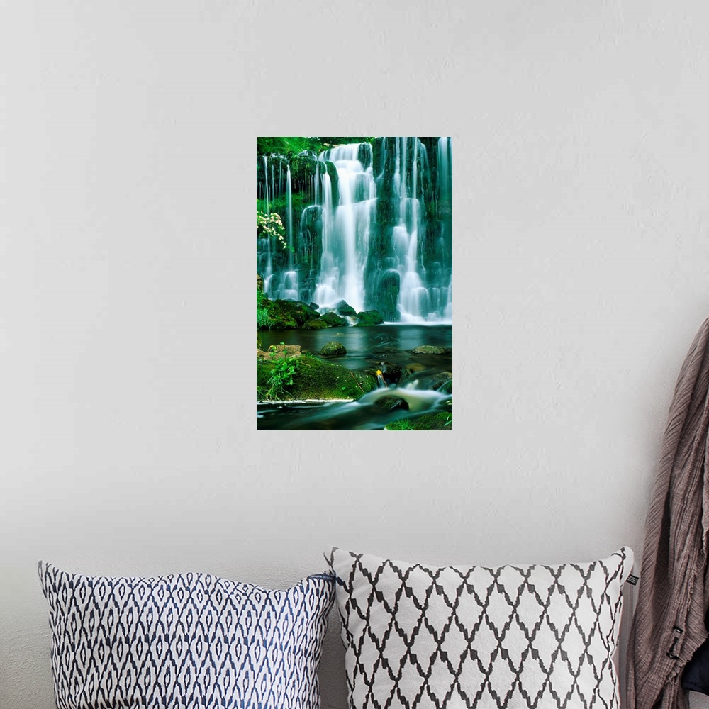 A bohemian room featuring This oversized art work is a time lapse photograph capturing the continuous cascade of water flow...