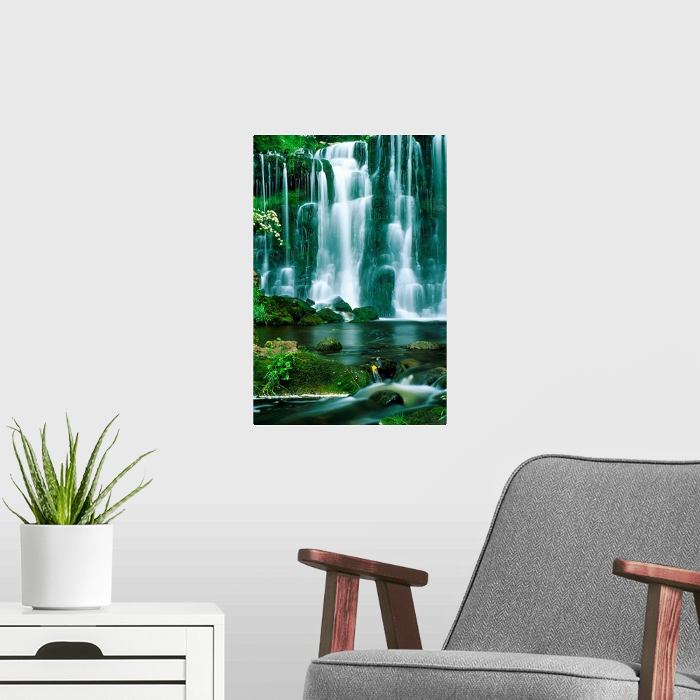 A modern room featuring This oversized art work is a time lapse photograph capturing the continuous cascade of water flow...