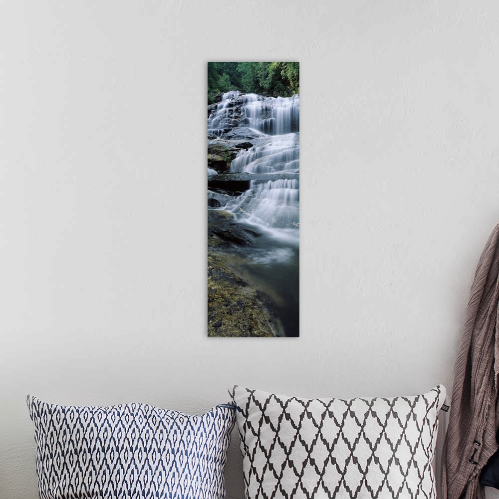 A bohemian room featuring Vertical panoramic of a series of smaller waterfalls making up a large stairway of water pouring ...