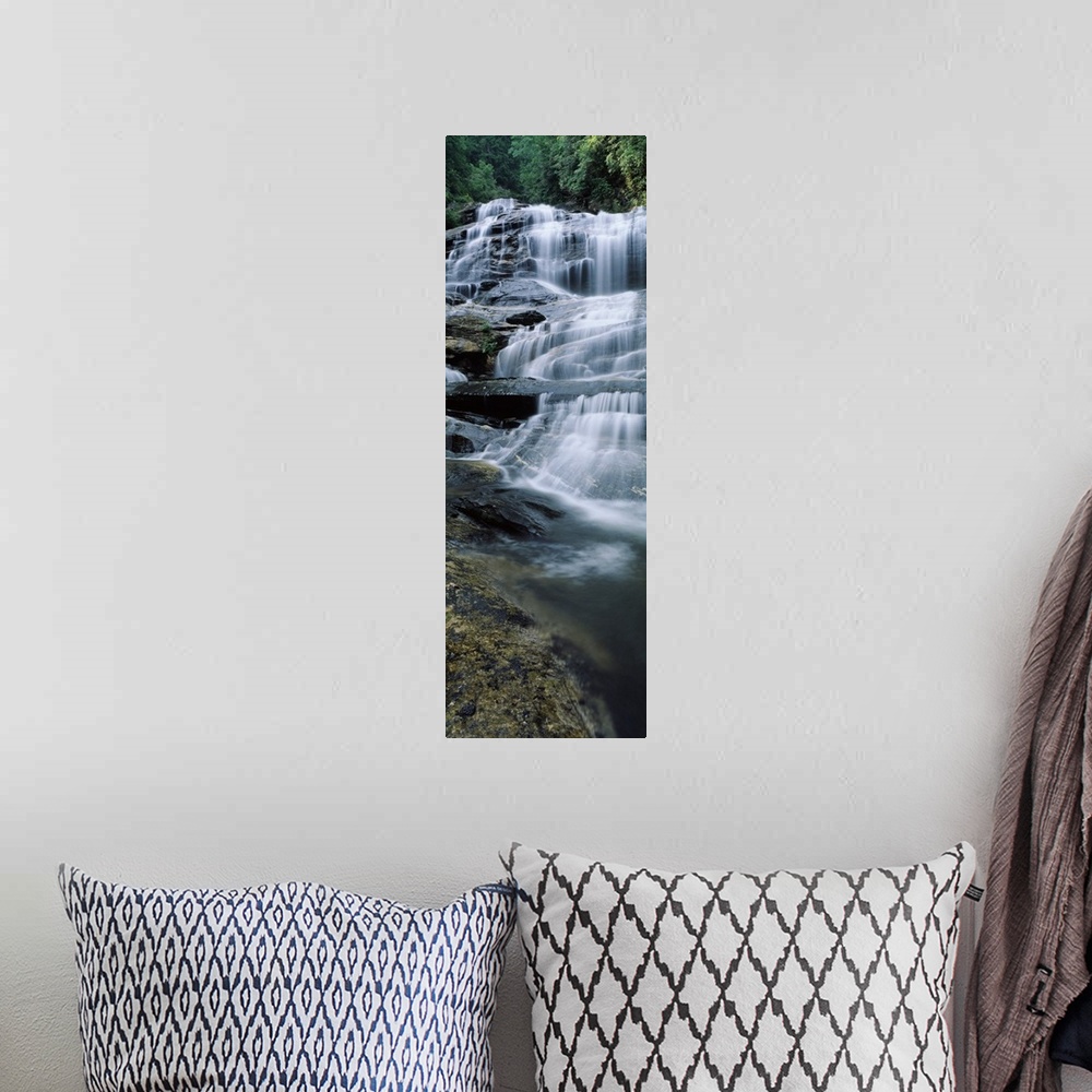 A bohemian room featuring Vertical panoramic of a series of smaller waterfalls making up a large stairway of water pouring ...