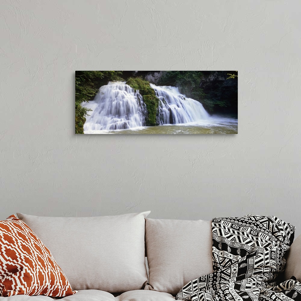 A bohemian room featuring Waterfall in a forest, Loue Waterfall, Jura, Franche Comte, France